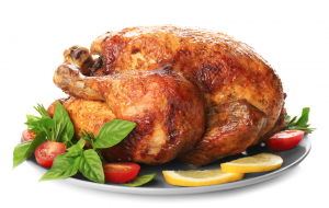 Image of a roast turkey on a plate with vegetables